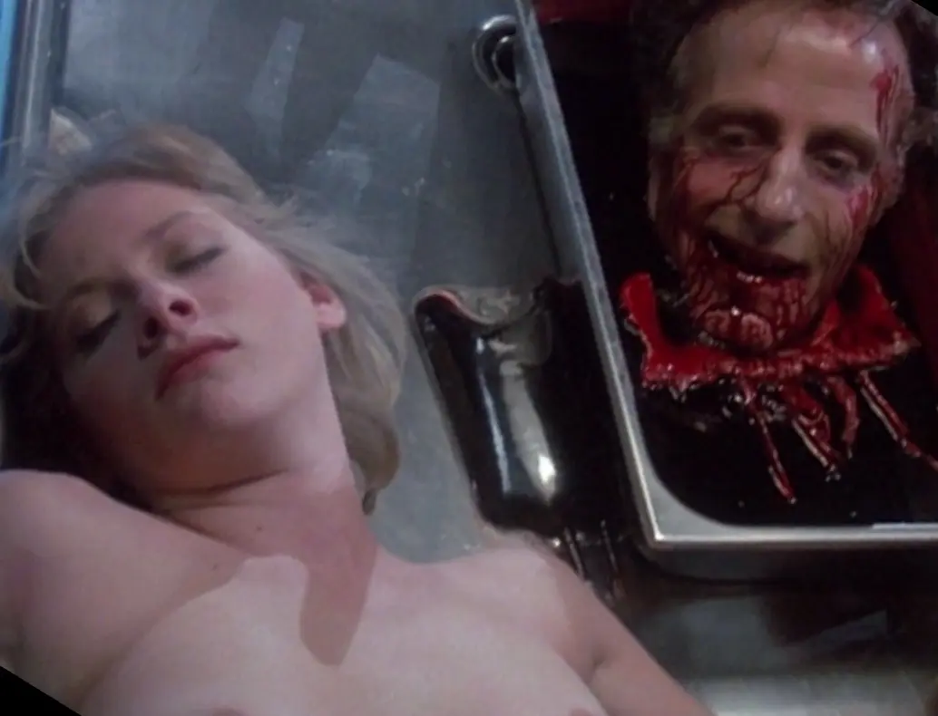 Barbara Crampton and David Gale in Re-Animator