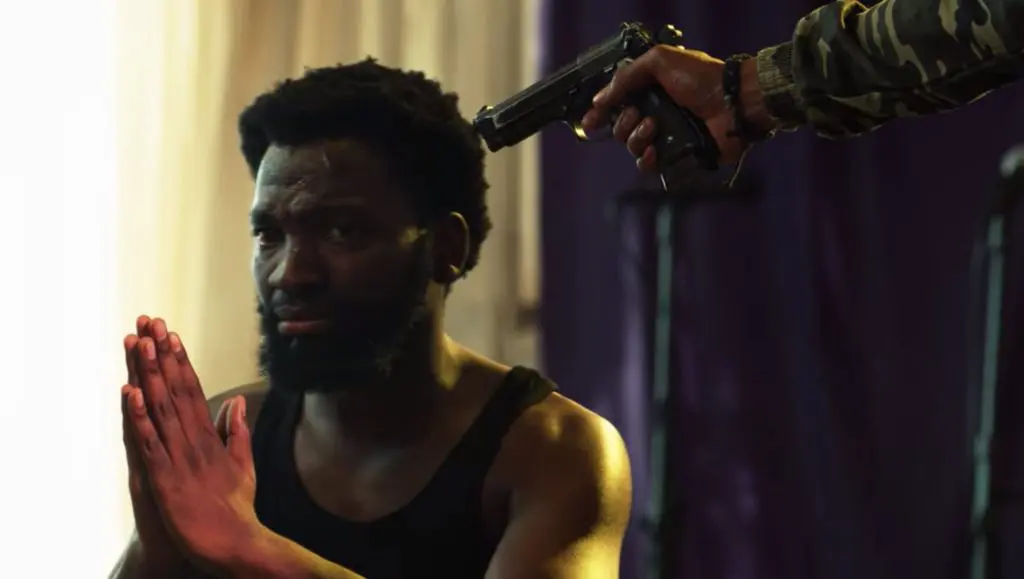 Shandu threatens the Pastor in Queen Sono season 1, episode 3 - The Devil's Toys - Netflix Series