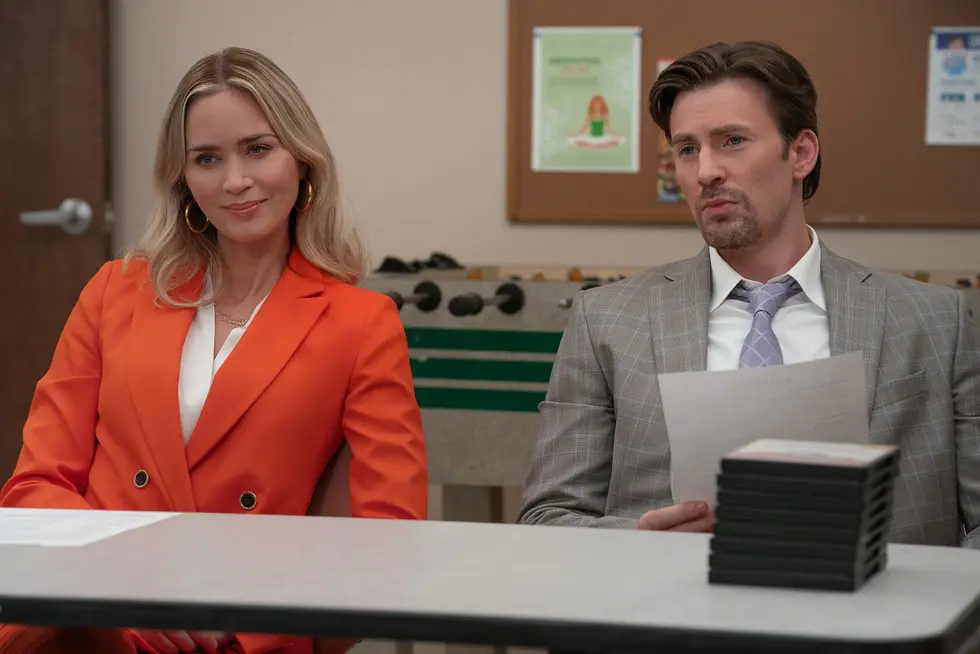 Emily Blunt and Chris Evans in Pain Hustlers Image