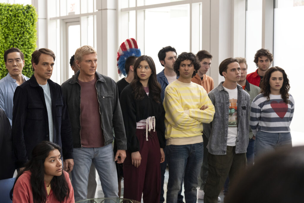 (L to R) Yuji Okumoto as Chozen, Ralph Macchio as Daniel LaRusso, William Zabka as Johnny Lawrence, Oona O’Brien as Devon, Gianni DeCenzo as Demetri, Xolo Maridueña as Miguel Diaz, Tanner Buchanan as Robby Keene, Mary Mouser as Samantha LaRusso in Cobra Kai.