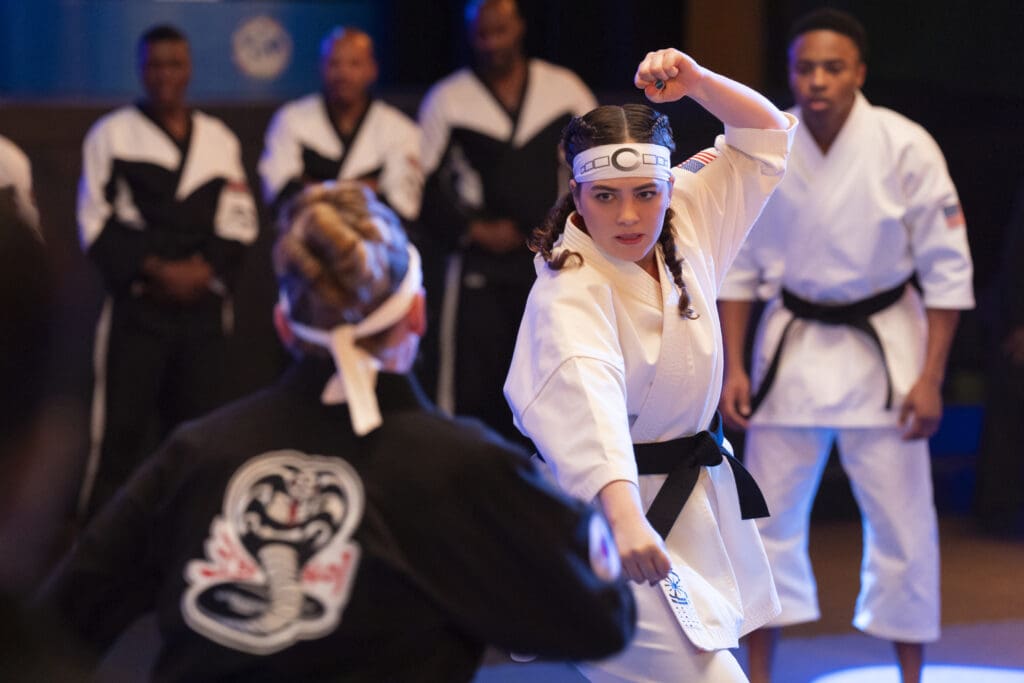 (L to R) Mary Mouser as Samantha LaRusso, Dallas Dupree Young as Kenny in Cobra Kai.