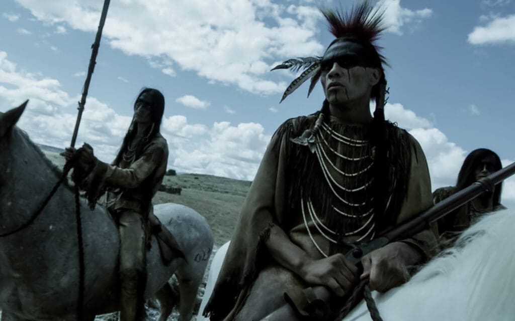 (L to R) Tokala Black Elk as Buffalo Run and Derek Hinkey as Red Feather in American Primeval.