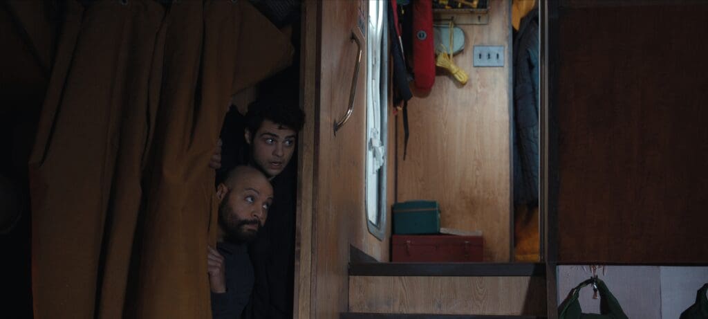 (L to R) Colton Dunn as Lester Kitchens, Noah Centineo as Owen Hendricks in Episode 206 of The Recruit.