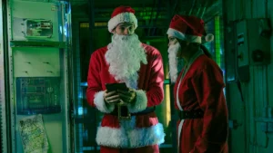 An image of Connor Swindells and Olivia Holt in Netflix 2025 film Jingle Bell Heist