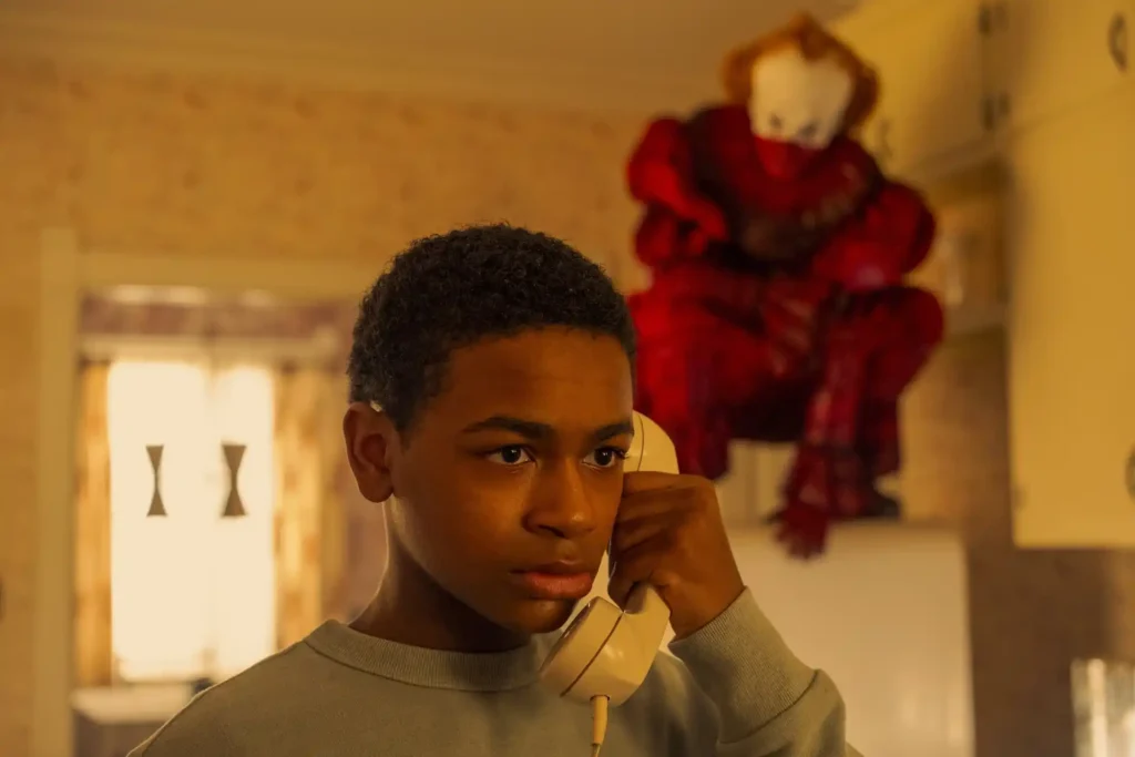 Blake Cameron James and Bill Skarsgard in It: Welcome to Derry