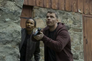 (L to R) Fola Evans-Akingbola as Chelsea Arrington, Gabriel Basso as Peter Sutherland in episode 310 of The Night Agent.
