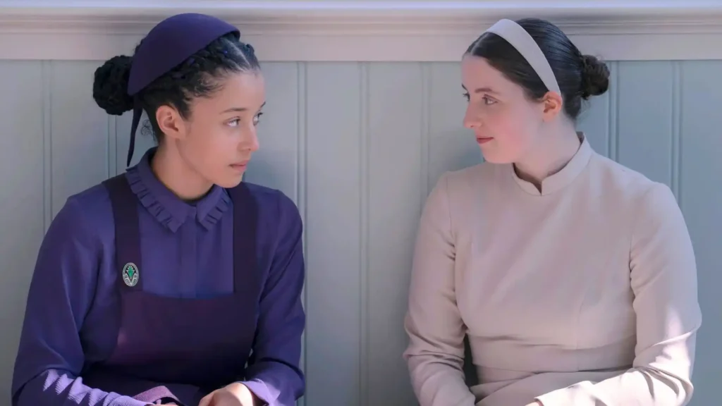 Chase Infiniti and Lucy Halliday in The Testaments