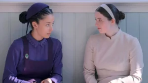 Chase Infiniti and Lucy Halliday in The Testaments