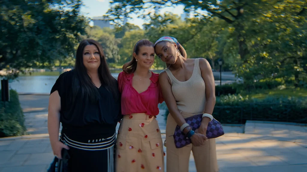 Dana Sue, Maddie, and Helen standing closely together and smiling in Sweet Magnolias Season 5