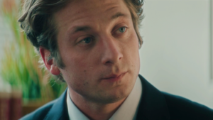 Close-up of Carmy Berzatto (Jeremy Allen White) wearing a suit and tie during his architecture firm interview in The Bear Season 5, Episode 8 finale