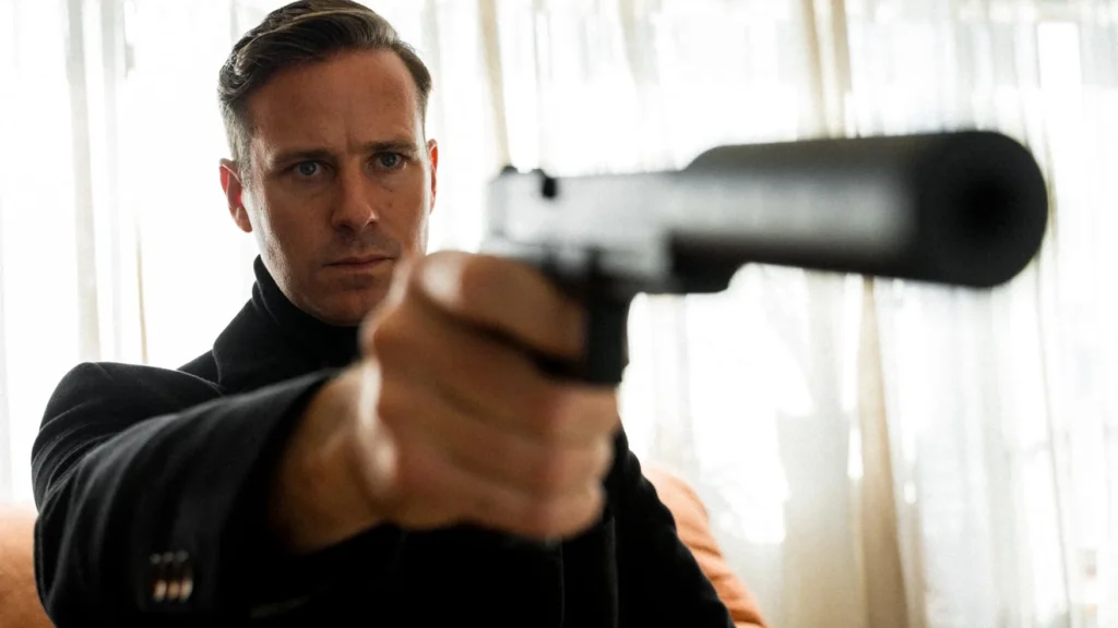 Armie Hammer aims a silenced handgun in a scene from Uwe Boll's movie Citizen Vigilante