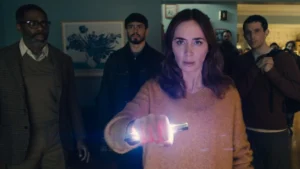 Emily Blunt as Margaret in Disclosure Day holding a glowing sci-fi crystal object