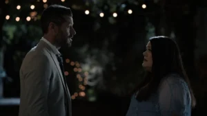 Ronnie and Dana Sue looking at each other with tense expressions during a night scene in Netflix's Sweet Magnolias Season 5